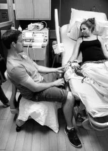 Husband with wife in labor