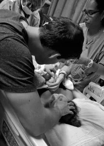 holding newborn baby for the first time